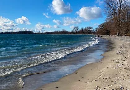 Sand beach on the south shore of Amherst Island, Ontario, looking out over Lake Ontario